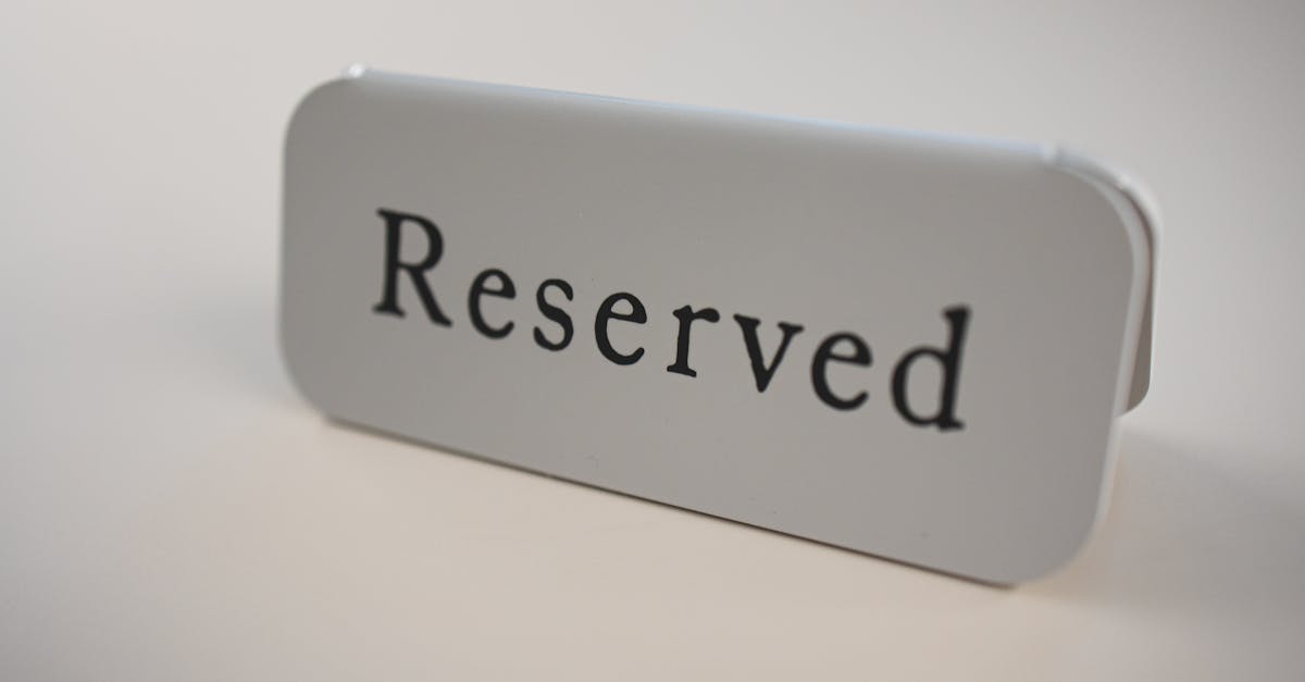 Close-up of a minimalist reserved sign on a table, ideal for restaurants or events.